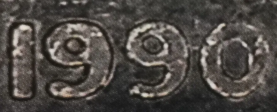 10 penniä 1990 variantti 1.2 tunnuspuoli